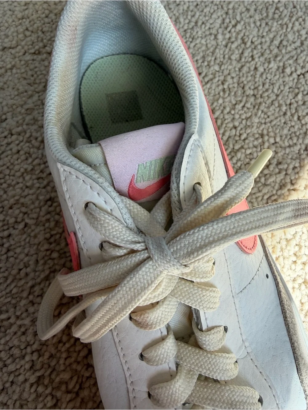 Nike White Leather Low-Top Sneakers with Pink Swoosh